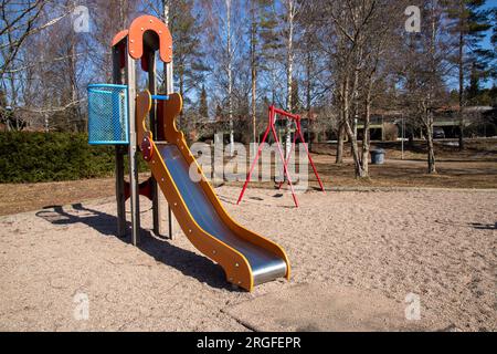 a slide at empty playground during spring Stock Photo