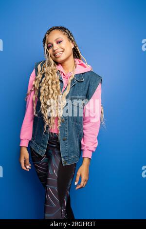 Side view of happy beauty woman in leggings put on hoodie in gray sweatshirt.  Full body length isolated on white background Stock Photo - Alamy