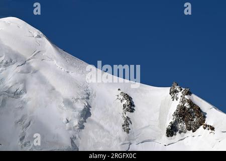 Bosses ridge of Mont Blanc with Vallot hut and observatory with blue sky Stock Photo