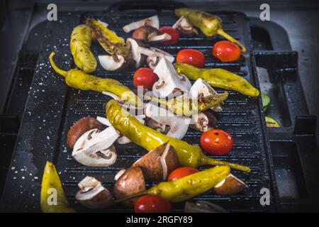 Freshly grilled vegetables in a grill pan on the grill. Italian antipasti. Stock Photo