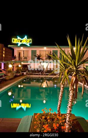 Bel Aire Motel, Pool at Night with Large Neon sign and Palm Trees, Wildwood, NJ Stock Photo