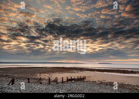 Sunset over Llanfairfechan beach on the North Wales coast Stock Photo