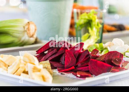 Beetroot and other vegetables cut into small pieces as a raw vegetable platter Stock Photo