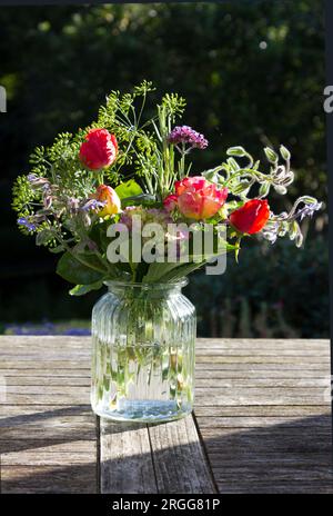 Vase of flowers on a table Stock Photo