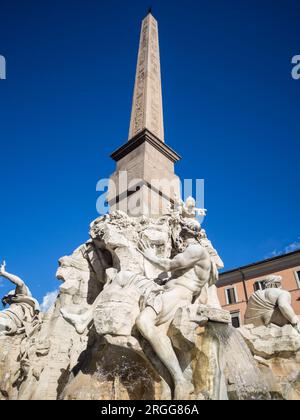 Sitting at the center of Piazza Navona is Bernini's sculpture in marble - the Fontana dei Quattro Fiumi also known as the Fountain of the Four Rivers. Stock Photo