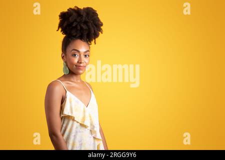 Positive pretty millennial black curly lady in dress enjoy weekend Stock Photo