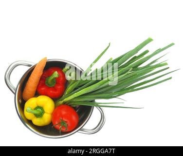 Fresh vegetables into a cooking pot isolated on white transparent background Stock Photo