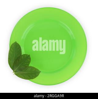 Green empty plate and fresh leaves isolated on white transparent background, top view Stock Photo