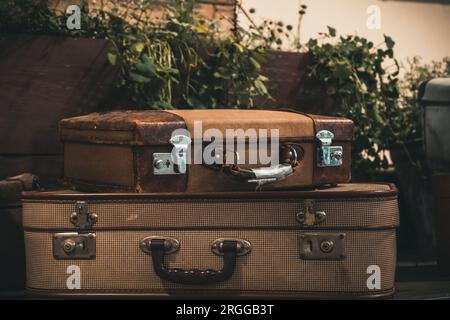Two old classic travel leather suitcases. Travel luggage concept. Vintage decoration. Stock Photo