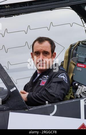 Pilot Dave Davies, Royal Air Force BAe Hawk solo display pilot in cockpit of jet plane. Canopy explosive cord for emergency ejection seat Stock Photo