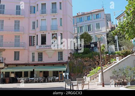 Picturesque corner of Cannes by the harbour in the Vieux Port area. Traditional shuttered buildings accommodate modern bars, restaurants and services Stock Photo