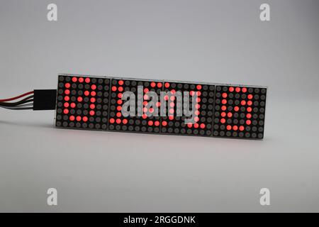 Matrix display board made from red dot LED showing some numbers. Binary numbers are shown on a matrix display Stock Photo