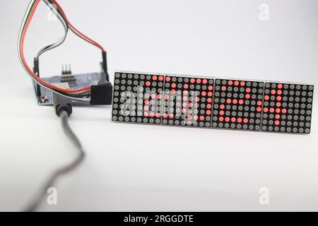 LED matrix display showing the number 2024 and is controlled by a programmable micro controller. Electronic number digital display Stock Photo