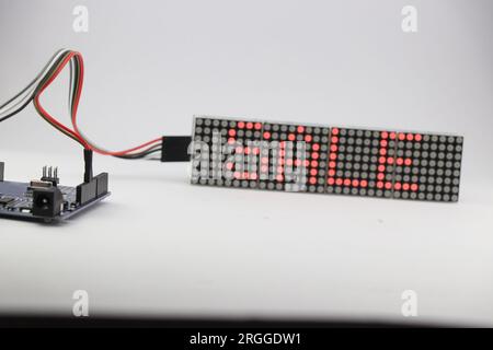 The word SALE is displayed on a LED dot matrix display as an advertisement. Concept of homemade useful electronic projects Stock Photo