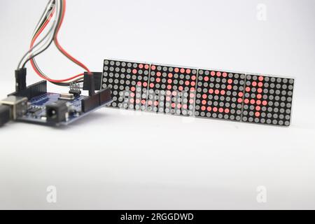 LED dot matrix display project with 2024 being displayed made at home using microcontroller and jumper wires Stock Photo