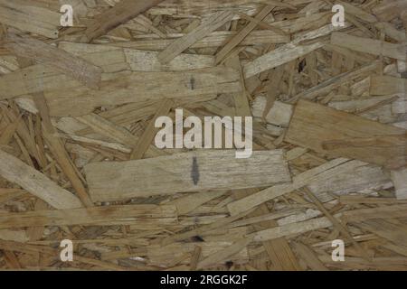 OSB board texture. Brown wooden background. Simple pressed