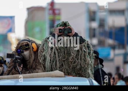 Gaza, Gaza, Palestine. 9th Aug, 2023. Members of the Al-Quds Brigades raise their weapons while participating in a large military march (Credit Image: © Saher Alghorra/ZUMA Press Wire) EDITORIAL USAGE ONLY! Not for Commercial USAGE! Stock Photo