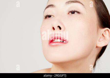 Young woman wearing pink lipstick Stock Photo