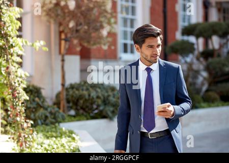 Businessman using smart phone Stock Photo