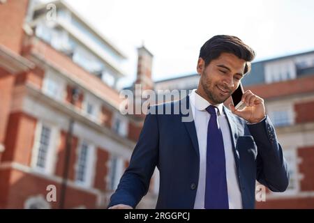 Businessman talking on smart phone Stock Photo