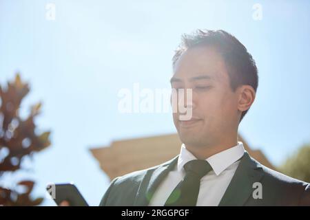 Businessman using smart phone Stock Photo