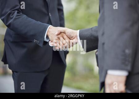 Hands of businessmen shaking hands Stock Photo