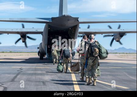 U.S. Air Force Airmen enter the cargo hold of a C-130J Hercules, Dyess Air Force Base, Texas, April 13, 2023. Photo by  Jakob Hambright Stock Photo