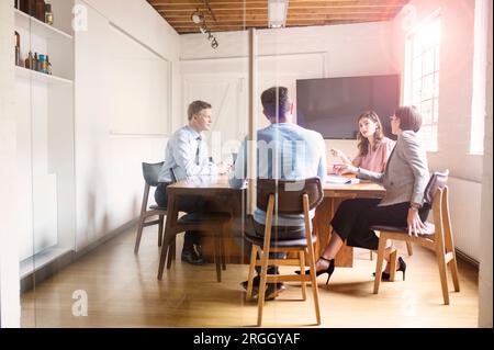 Businesspeople at meeting in office conference room Stock Photo