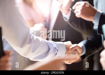 Shaking hands of businessmen in office meeting Stock Photo
