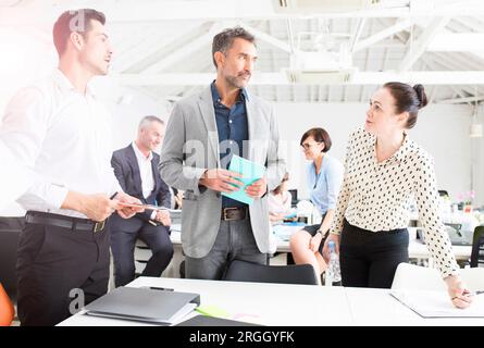 Businesspeople working together in office Stock Photo