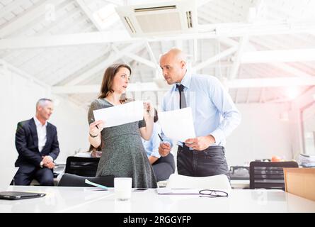 Businesspeople working together in office Stock Photo