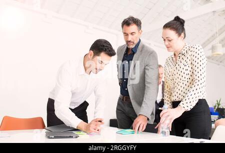 Businesspeople working together in office Stock Photo