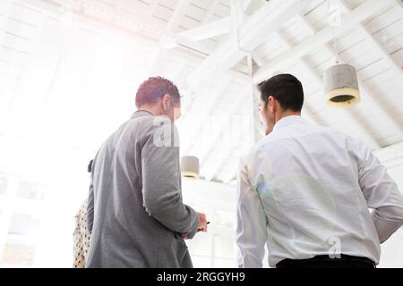 Businessmen working together in office Stock Photo