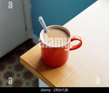 Red tea mug with spoon Stock Photo