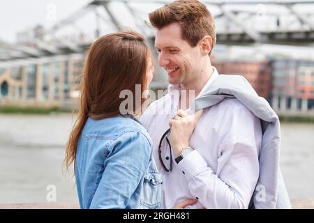 Mid adult couple smiling at each other Stock Photo
