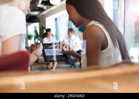 Businesswomen using digital tablet Stock Photo
