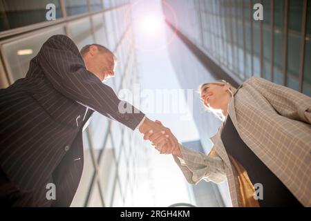 Low angle view of businesspeople shaking hands Stock Photo