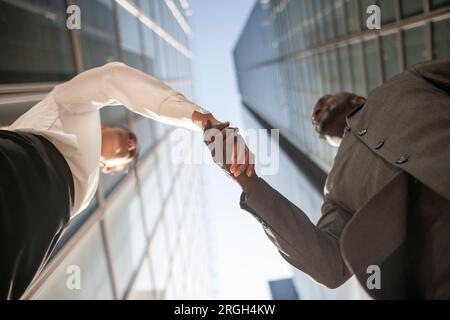 Low angle view of businesspeople shaking hands Stock Photo