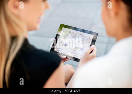 Businesswomen using digital tablet Stock Photo