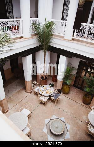 High angle view of man at dining table in courtyard Stock Photo