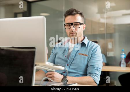 Young man working on laptop Stock Photo