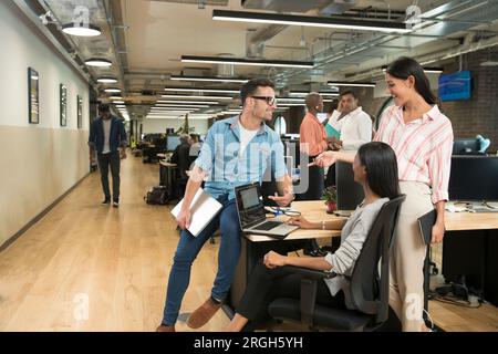 Colleagues talking in office Stock Photo