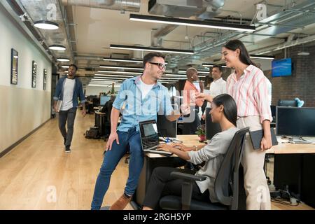 Colleagues talking in office Stock Photo