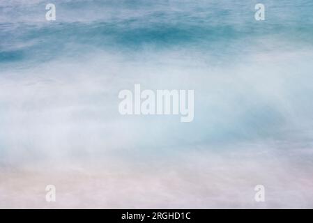 A seascape abstract wave background, panning motion blur with a long exposure, pastel colors in a vintage and retro style. Stock Photo
