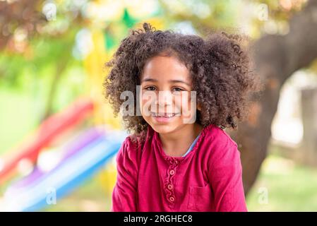 happy girl portrait, child smiling with tears in eyes, happy African American child Stock Photo