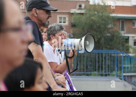 Madrid, Spain. 09th Aug, 2023. A woman chants slogans on a megaphone during a rally in the San Blas neighborhood in Madrid. As of August 9, 2023, Spain registers 35 sexist murders against women so far this year. Credit: SOPA Images Limited/Alamy Live News Stock Photo