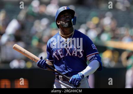 Texas Rangers right fielder Adolis Garcia (53) runs back to the dugout  after the end on an inning during a baseball game on Saturday, April 22,  2023, in Arlington, Texas. (AP Photo/Richard