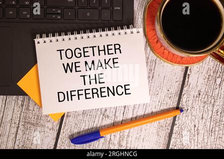 Together We Make the Difference inspirational text on yellow sticky note and red background. Stock Photo