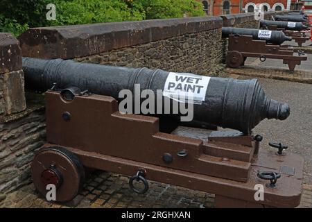 Wet paint, repainting historic Cannons on the Londonderry walls, pointing out from the city, County Derry, Northern Ireland, UK, BT48 6PJ Stock Photo