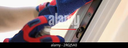 Service man installing new window sash to client close up. Stock Photo